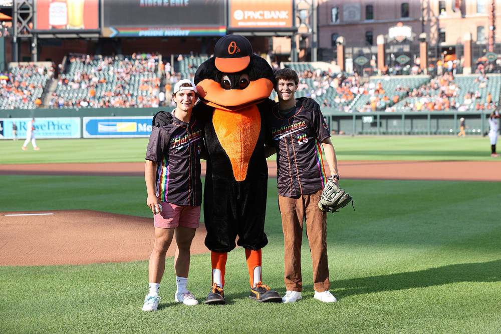 The Oriole Bird poses with Cole Philpott and Aiden Phipps '25.