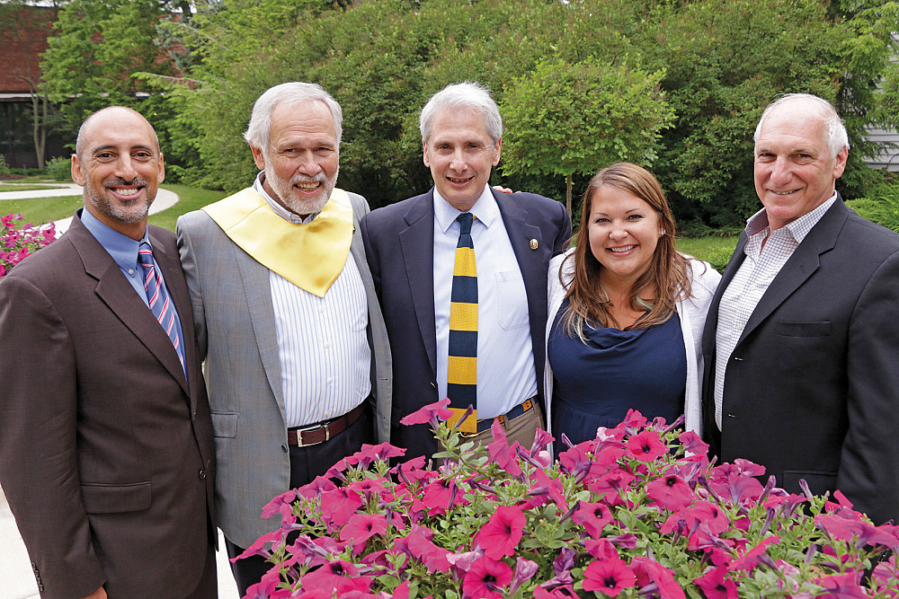 Distinguished Service Citation and Young Alumni Award recipients join President Scott Bierman during Reunion Weekend. From left are David...