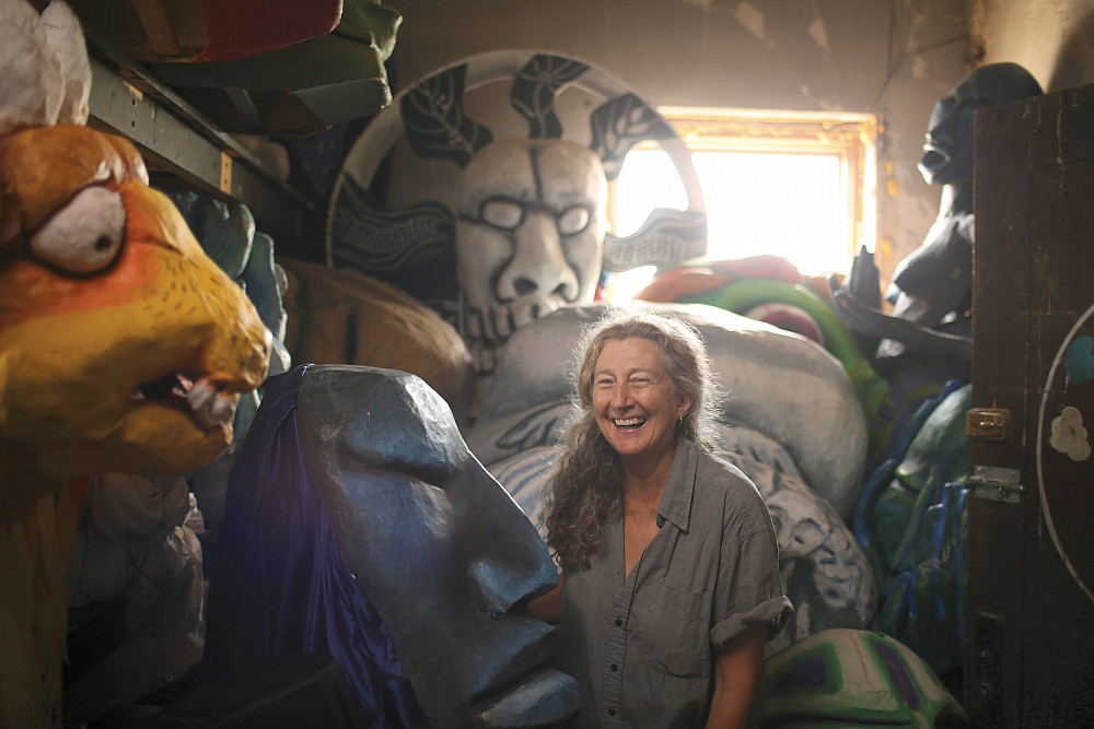 Sandy Spieler'75 in the attic where In the Heart of the Beast stores their archive of puppets Wednesday afternoon.