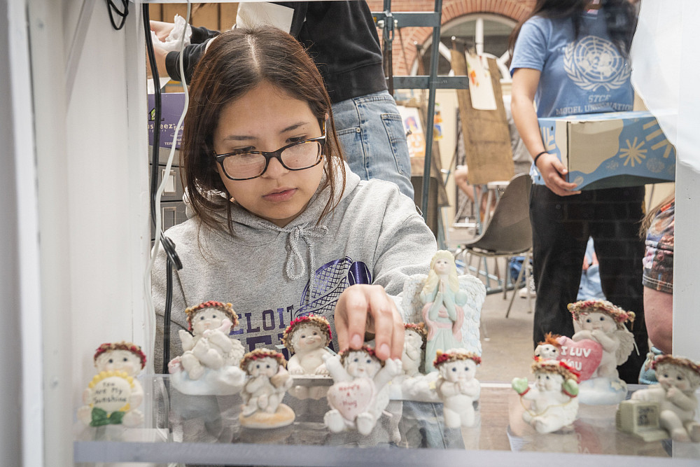 Porter Scholar and current Beloit Memorial High School student Karla Martinez arranges a few Drea...