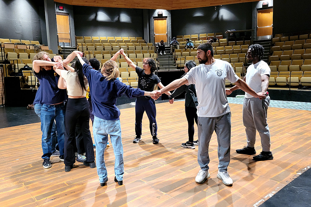 A theatre trust exercise with José Guillen'24, Jace Roddey'27, and other members of the cast.