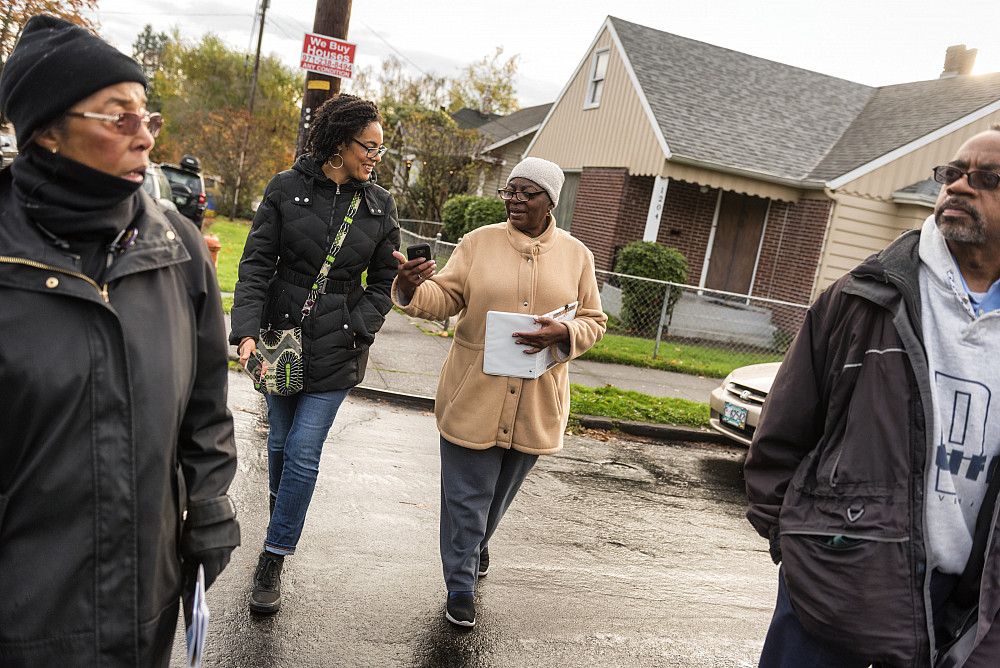 From left: Shirley Minor, Raina Croff'99, Deloris Griggs, and Cecil Prescod on a recent walk in Portland. We buy houses, the sign on...