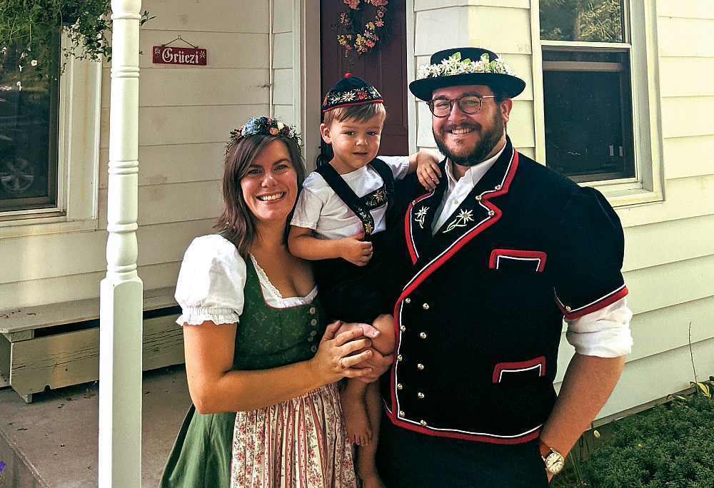 Greg Long'09, his wife Cassie, and their son Gordon in traditional Swiss dress.