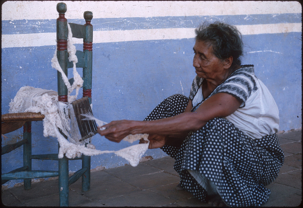 Odona Valentín uses a special loom to weave fringe. Bristol took this photo in Oaxaca in 1966.