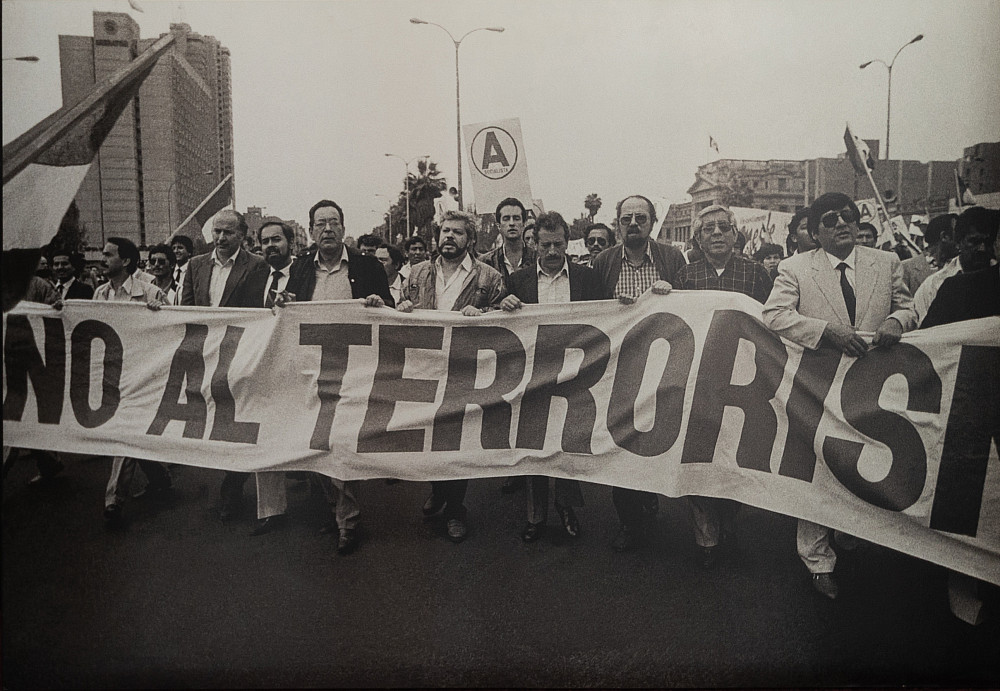 A Lima protest holding the sign reading No al Terrorism.