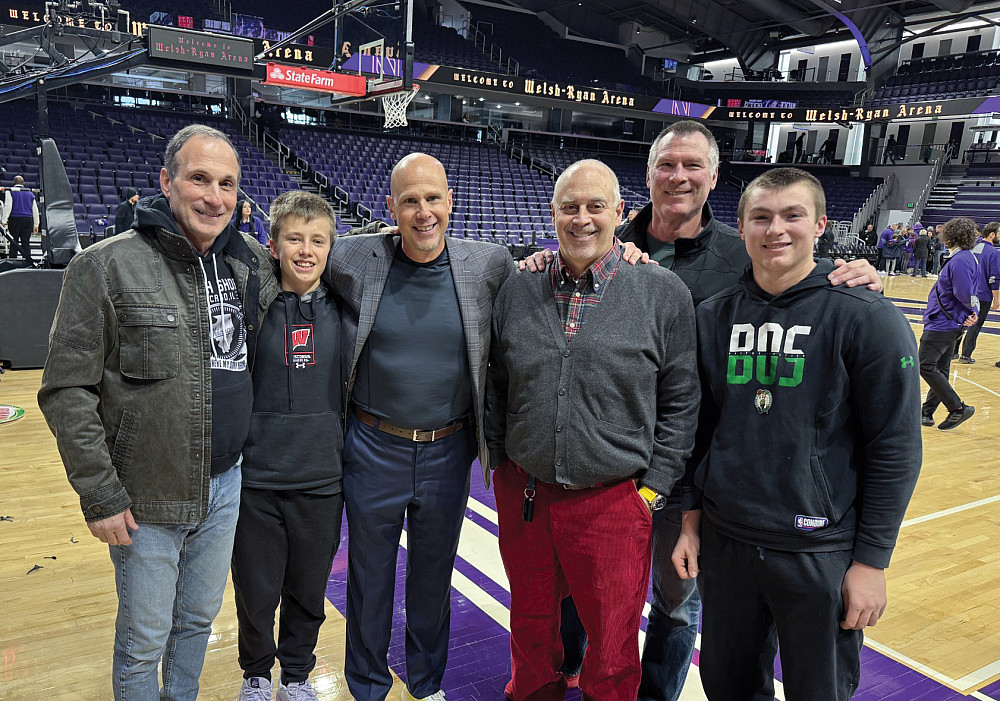 Class Notes - 85-86 Alumni at Badgers Basketball Evans Papanikolaou '86, Lance Randall '94, Brian Morello '85, and Bill Fitzgerald '86 at a Wisconsin Badgers basketball game.