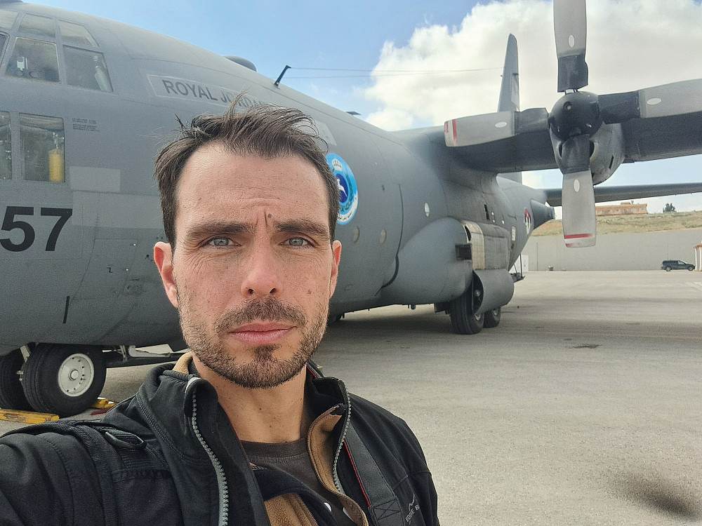 Taylor Luck'07 awaits takeoff on a humanitarian aid mission in April.