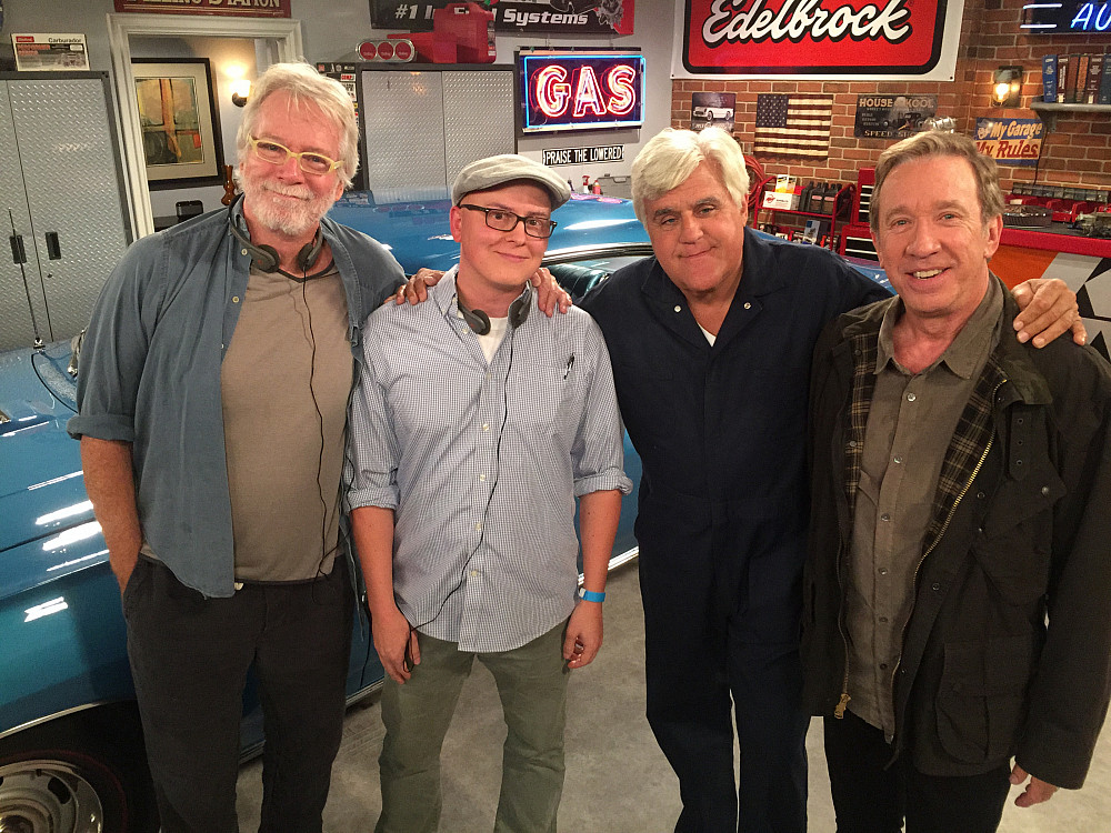 From left: John Pasquin'67, Jon Haller'02, Jay Leno, and Tim Allen on the set of Last Man Standing.