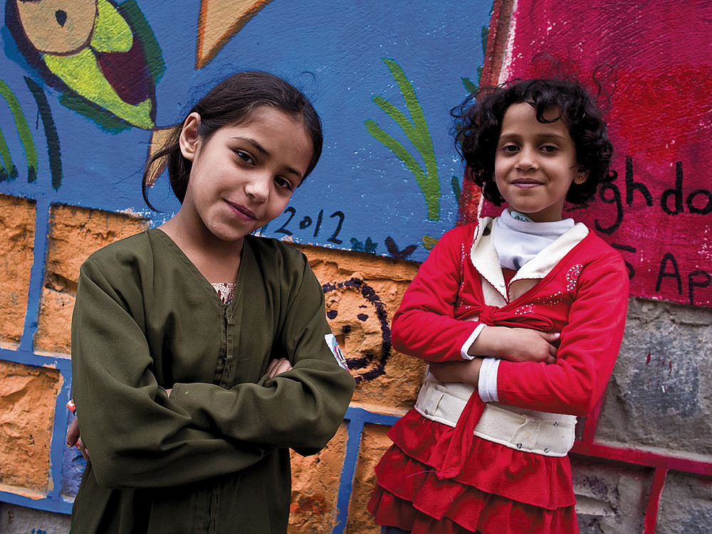 On Thursday in Sana'a, students gathered to paint the walls of a school damaged in fighting between government and tribal forces in 2011.
