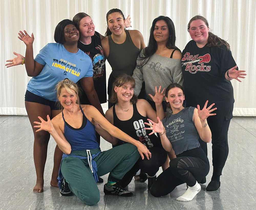Jazz Dance students posing together with jazz hands.
