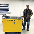 Karl Wedel with the tool tender he restored in the Powerhouse.