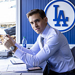 Joe Davis’10 prepares to announce a night game in the Dodger Stadium broadcasting booth.