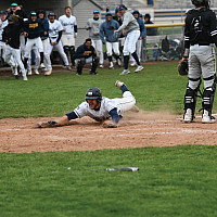 Baseball: Garrison Ferone Garrison Ferone sliding onto home base.