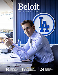 Joe Davis'10 gets ready to announce a night game in the Dodger Stadium broadcasting booth last July.