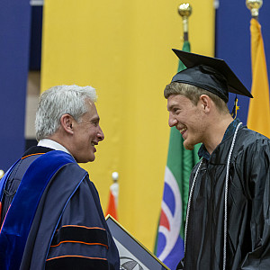 President Bierman congratulates Matthew Miller'19 on receiving the Blue Skies Award.
