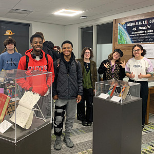 Students at the Ursula Le Guin exhibit in Morse Library in November.