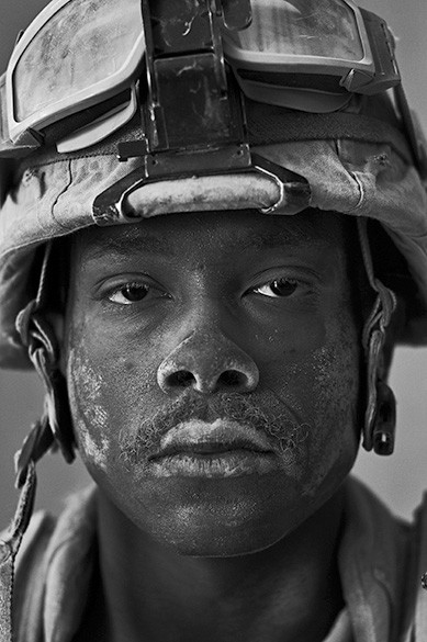 U.S. Marine Cpl. Philip Pepper, age 22, Garmsir District, Helmand Province, Afghanistan, photographed by Louie Palu, one of 14 photograph...