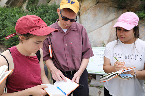 Professor Daniel Youd discusses field notes with Jennifer Pantelios'19 and Simone Rawal'20 while in China in 2017.