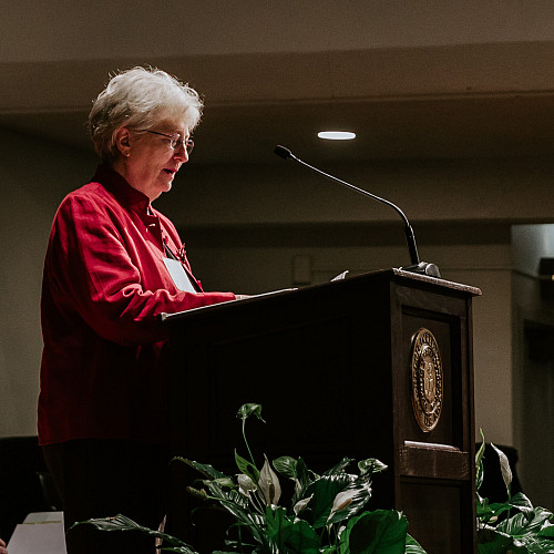 Carol O'Neill receiving the DSC on behalf of Amy O'Neill Grant'97.
