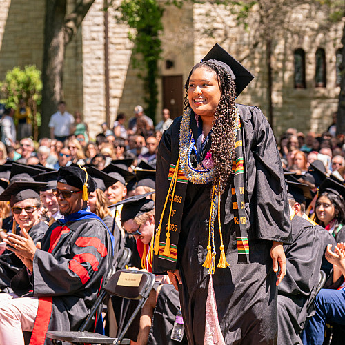 Jasmin Anna Bowers '25 walks to the stage to receive the Martha Peterson Prize.
