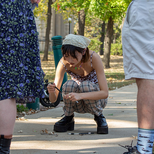 Tzu Ting Lin'24 demonstrates ephemeral Chinese calligraphy using water as her medium.