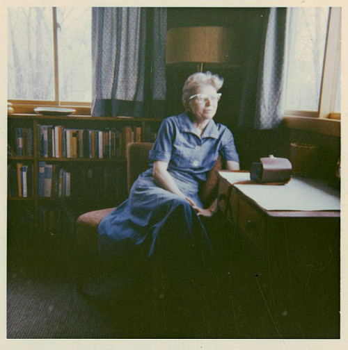 Lorine Niedecker at a writing desk.