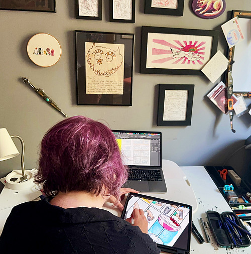Sarah Becan '98 working at her desk.