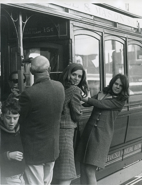 Susan Beebe'72, left, and Barbara Beck'70 on a trolley car. The roommates worked for the U.S. Passport Agency in San Francisco.