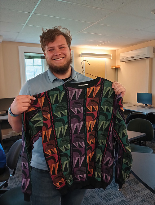 Trevor Cain'24 with one of Bob Elder's vintage patterned sweaters