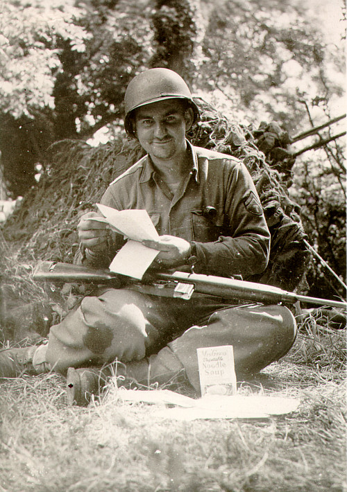 George Martin reads letters from home.