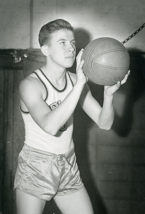 John Erickson'49 playing basketball as a student.