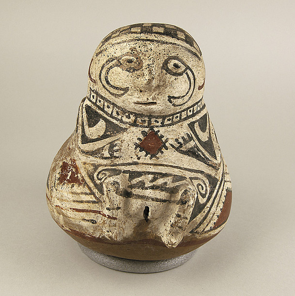 A prehistoric, Paquimé-style piece of pottery from the Logan Museum's archaeological collection. Next to it is a contemporary human...