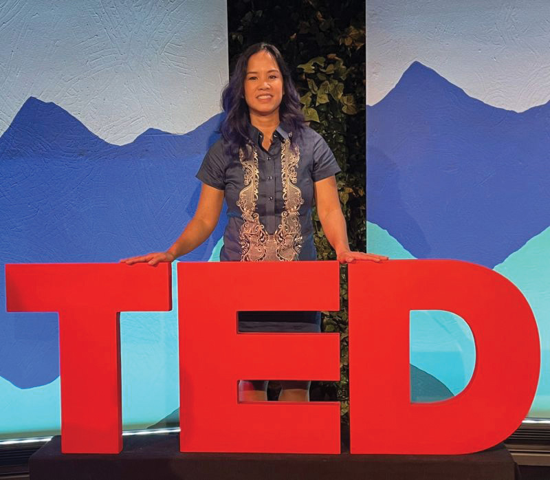 Dr. Beatriz Rodriguez-Fransen'02 Dr. Beatriz Rodriguez-Fransen'02 standing with a TED sign.