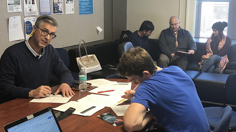 Inaugural Executive in Residence Matt Laszlo'92 (left) working with creative students in the course Navigating Your (Business) ...